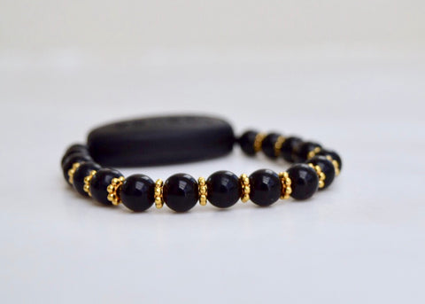 Polished Black Onyx - With Tibet Gold Daisy Spacers