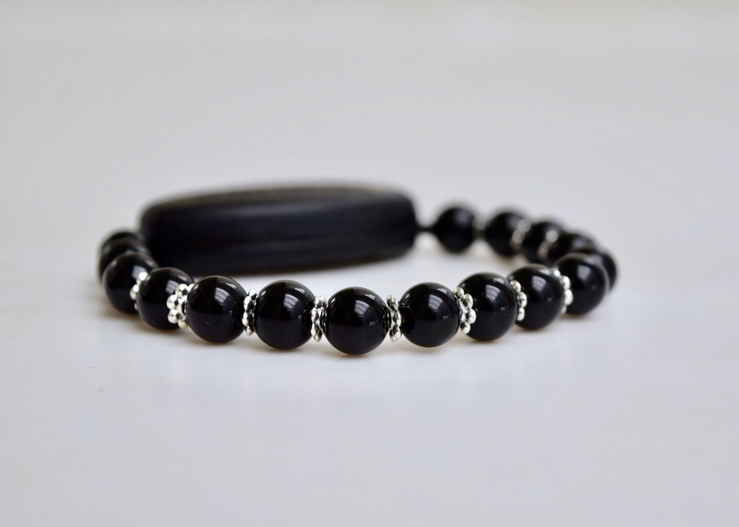 Polished Black Onyx - With Tibet Silver Daisy Spacers